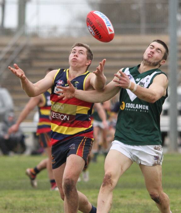 EASY PICKINGS: Crows player Tom Handsaker easily snags a pass intended for Coolamon's Harry Fitzsimmons. Photo: Ron Arel