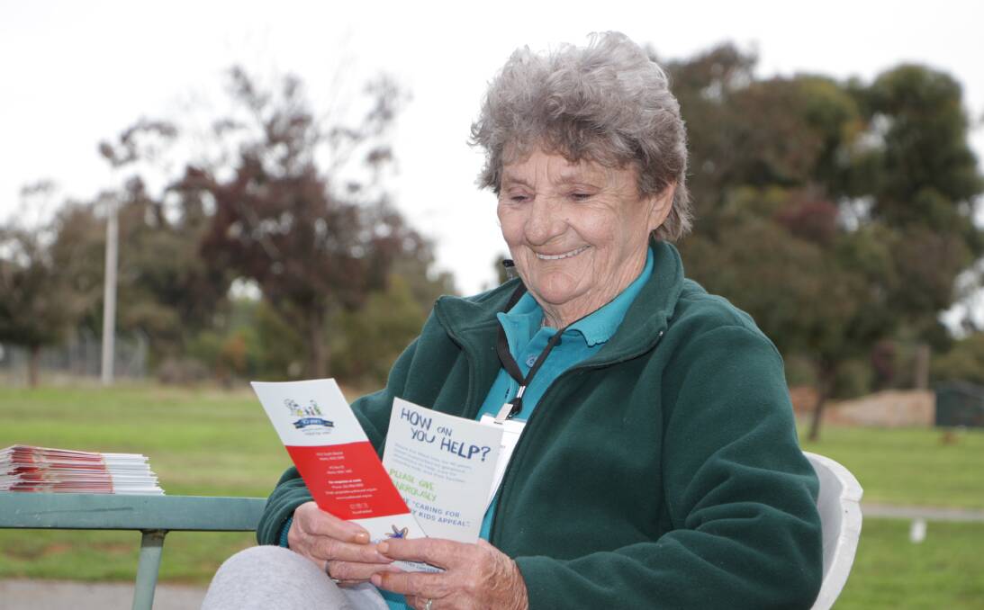 ALWAYS LOOKING TO HELP: Meryl Parker has a look at a couple of new brochures for the Royal Far West, one of the many charities she is passionate about.
