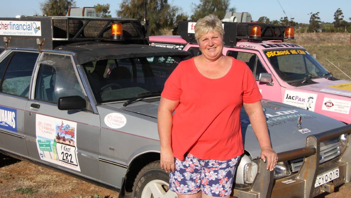 READY TO ROLL: Colleen Willis stands next to the cars that represent the Riverina in the cystic fibrosis rally that raises funds for the CF database.