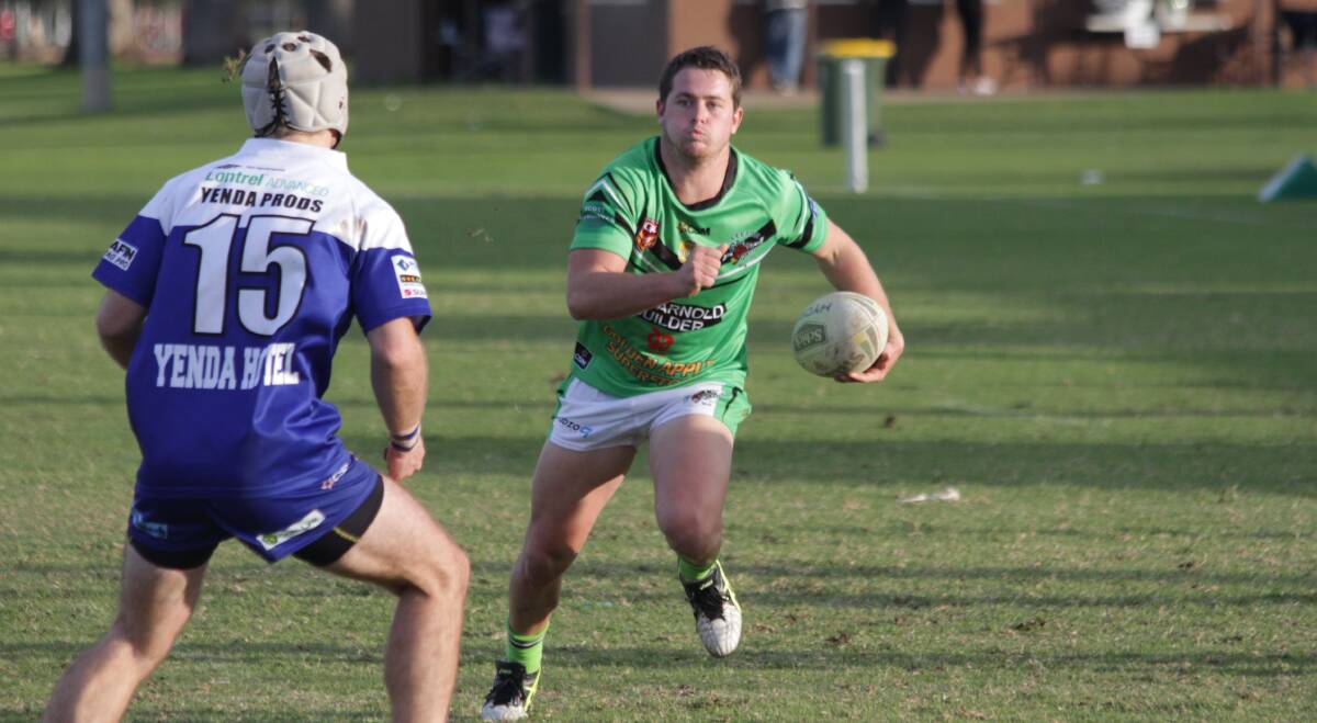 POWER THROUGH: Bas Blackett of the Leeton Greens charges at the Yenda Blueheelers line in last Sunday's match. Photo: Ron Arel