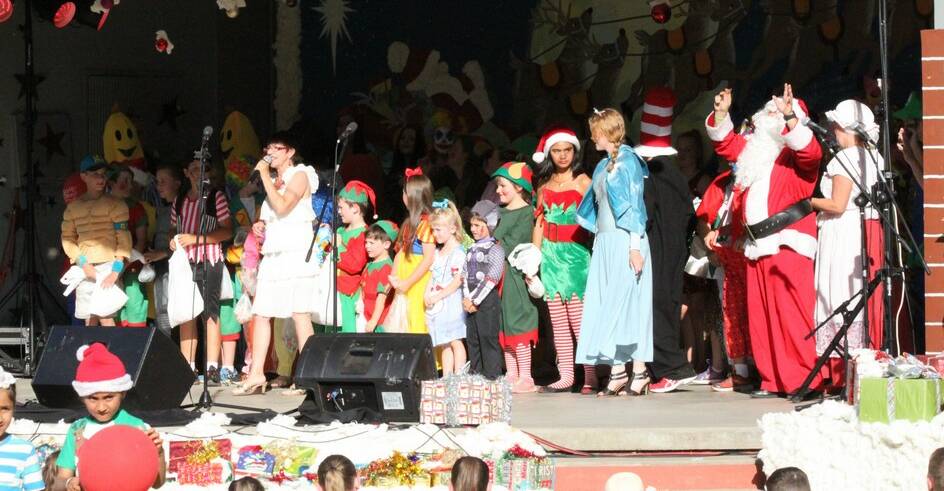 Christmas cheer: The concert is a popular element of the night with local performers taking to the stage. 