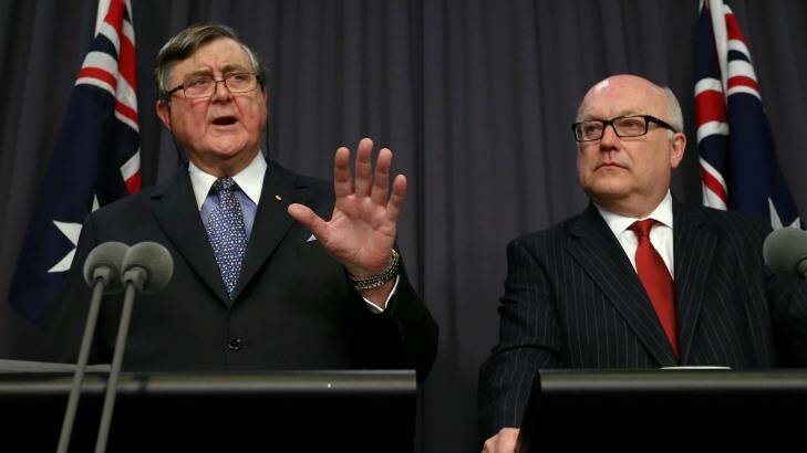 David Irvine (left), head of ASIO, and George Brandis both want metadata stored for fighting terrorism and crime. Photo: Alex Ellinghausen