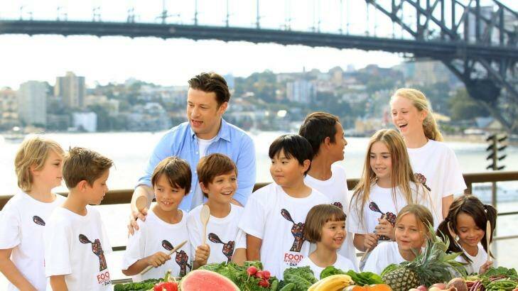 Jamie Oliver appears at the Opera House for a media call with a troop of kids to promote fresh healthy food for children. Photo: James Alcock