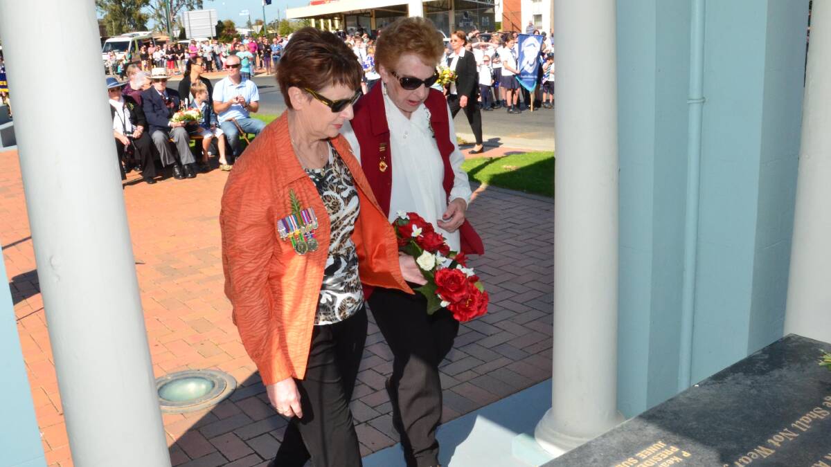Anzac Day in Junee. Jenny Morton and Brenda Schultz lay a wreath for Junee-Illabo Red Cross. Picture: Declan Rurenga 