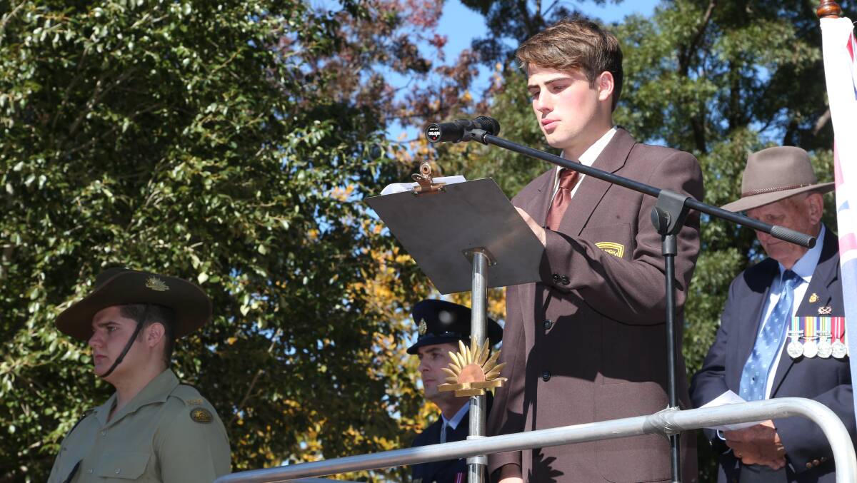 Anzac Day in Griffith. Wade High school captain Samuel Hutchinson reads a prayer. Picture: Anthony Stipo