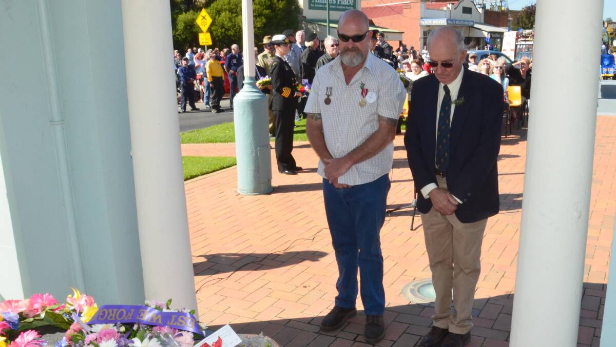 Anzac Day in Junee. Mark Cook and Adrian Eisenhauer lay a wreath for Junee Legacy.  Picture: Declan Rurenga 