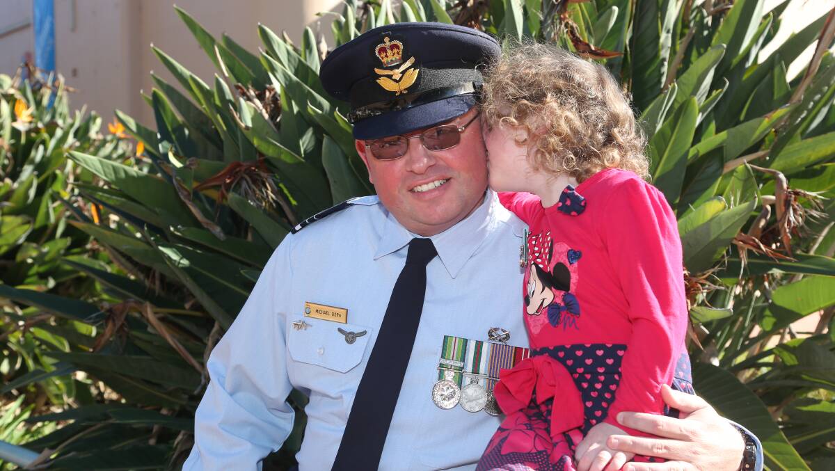 Anzac Day in Griffith. Michael Borg served in East Timor and is pictured with his daughter Rosemarie, who is wearing her great grandfather's medals. Picture: Anthony Stipo 