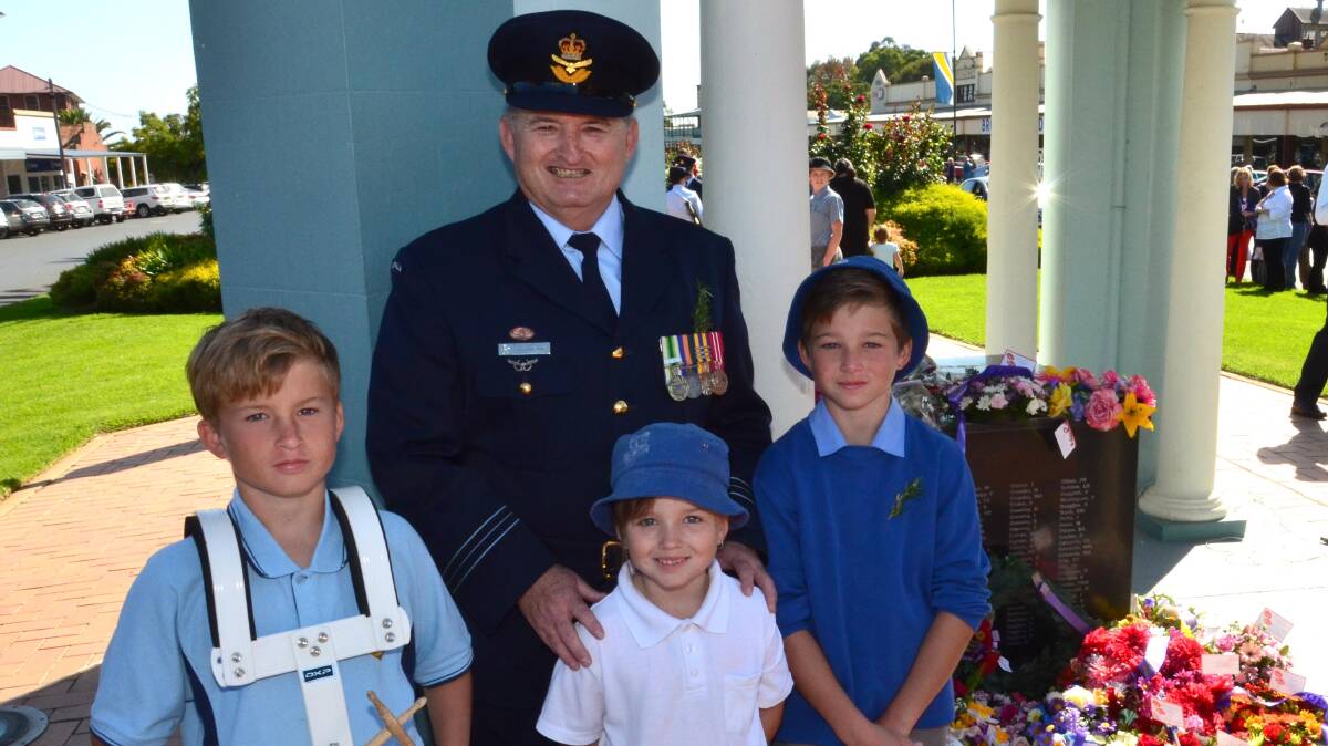 Anzac Day in Junee. Squadron Leader Peter Hogarth with children Joshua Hogarth, 12, Kira-Lee Hogarth, 7, and Nick Hogarth, 10. Picture: Declan Rurenga
