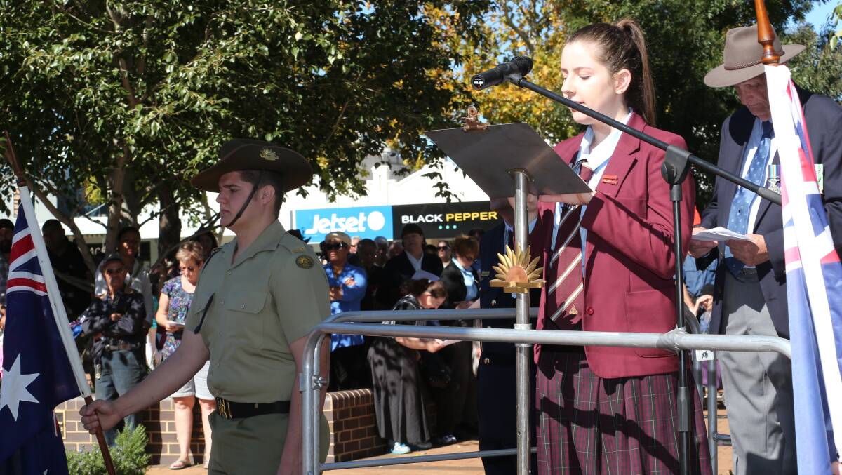 Anzac Day in Griffith. Marion Cattholic College school captain Emily Budd reads a prayer. Picture: Anthony Stipo 