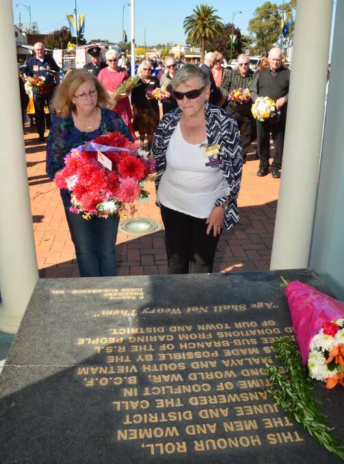 Anzac Day in Junee. Kim Anderson and Liz Evers lay a wreath for Junee VIEW Club. Picture: Declan Rurenga 