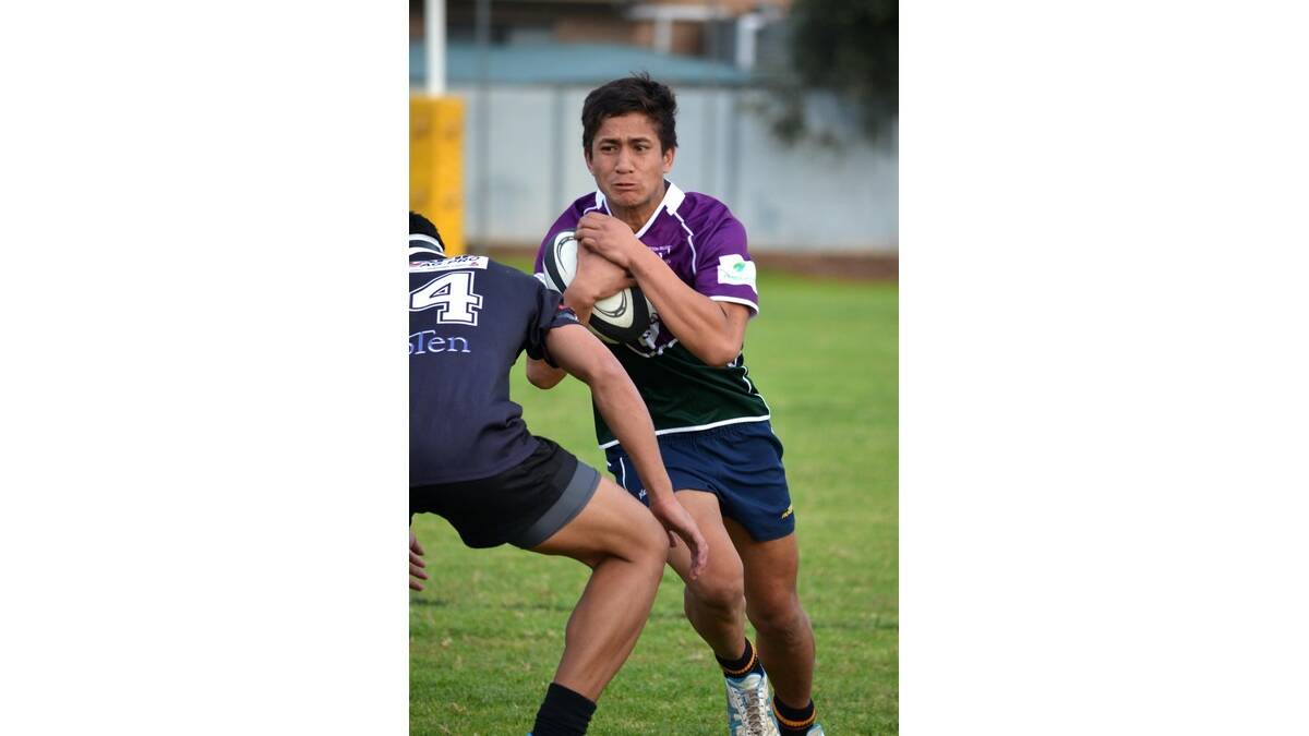 YOUNG Phantom Wayne Leao-Seve prepares for a big tackle from a Griffith Blacks player.