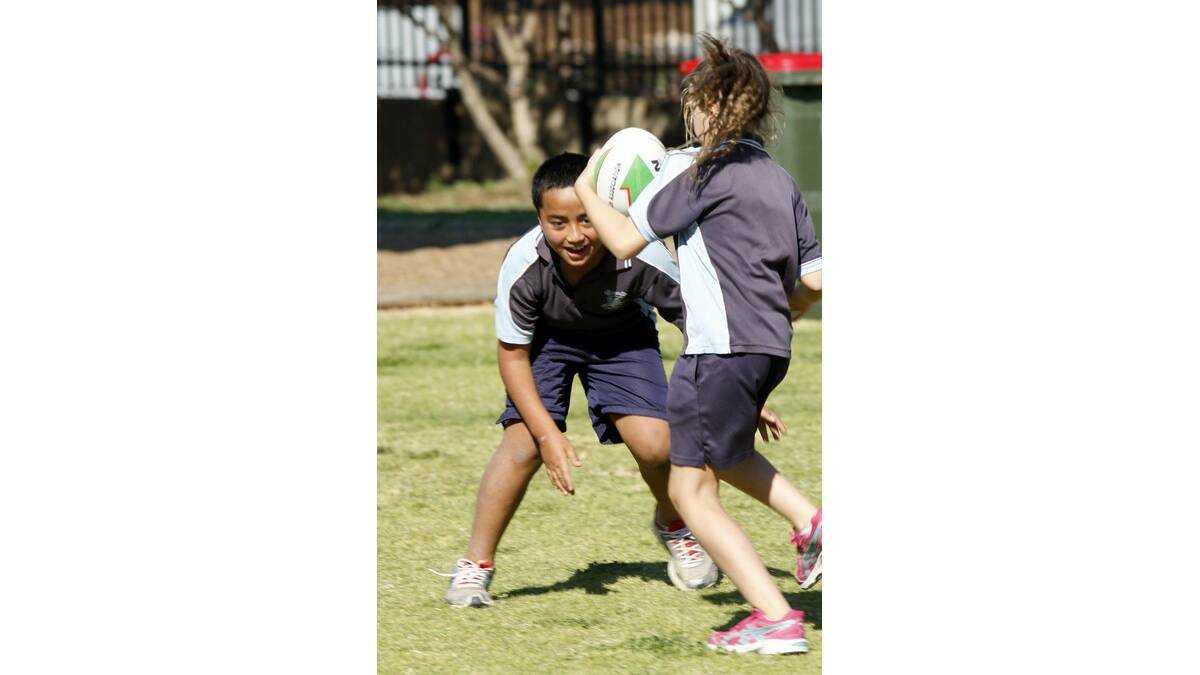 YEAR 3 student Talitiga Feagai comes up against classmate Sophie Cooper in an "off-side" drill.