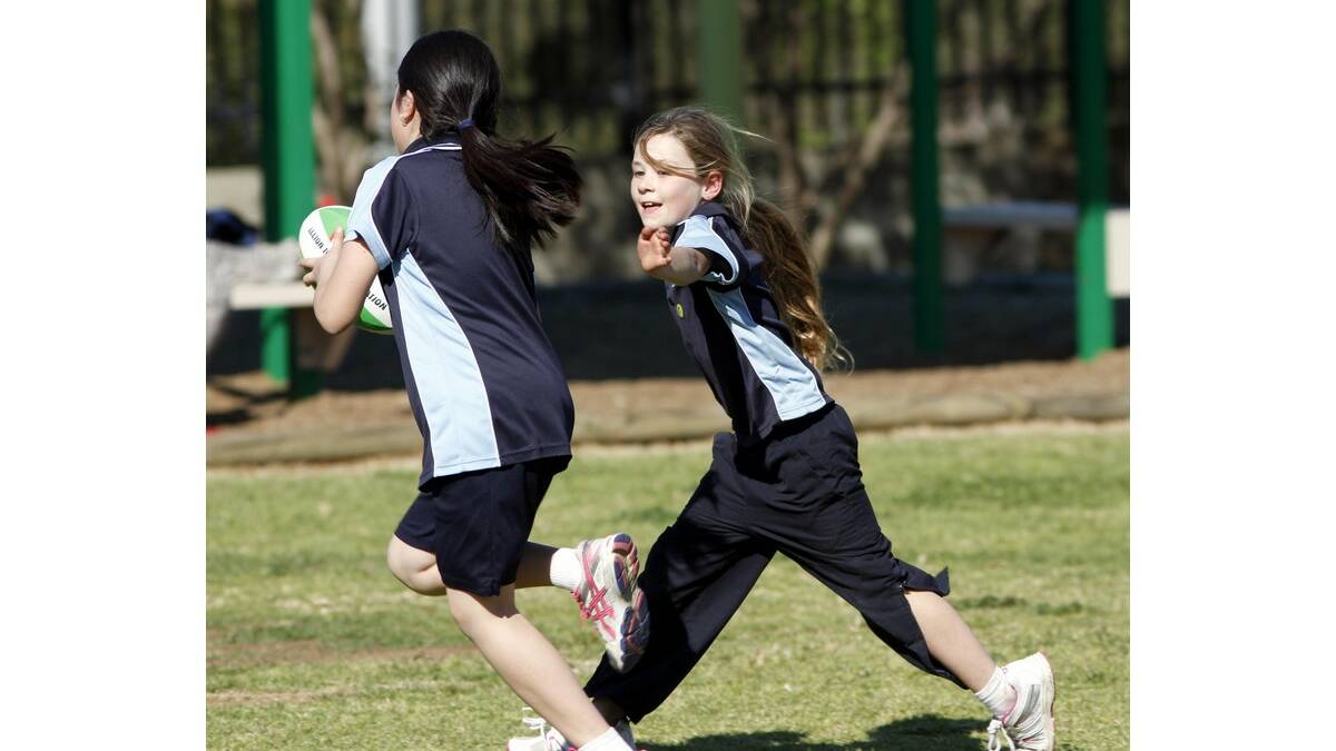 TYNISHA Walsh was too quick and managed to touch Ella Tang in this drill at St Joseph's Primary School.