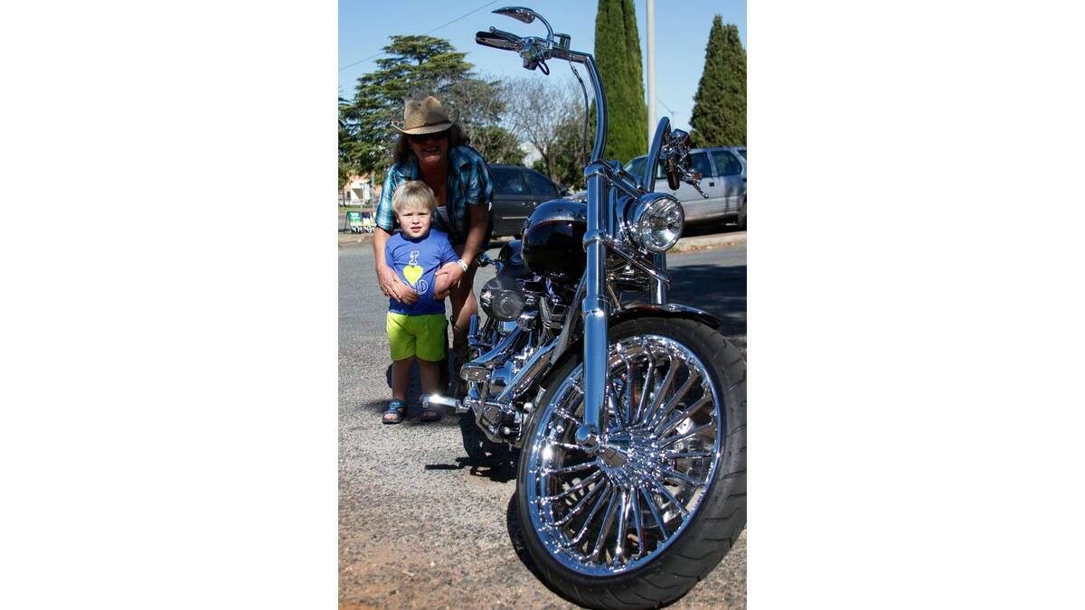 LIZ Vant with grandson Caleb Foote, 2, check out one of the bikes on the poker run last Saturday.