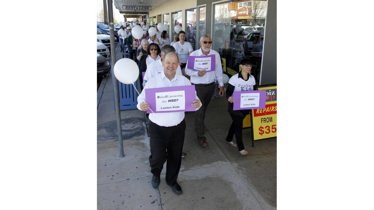 A WHITE Balloon Day awareness march was held last Friday, led by deputy mayor George Weston, Eric Pages (obscured), mayor Paul Maytom and Vanessa Pages.
