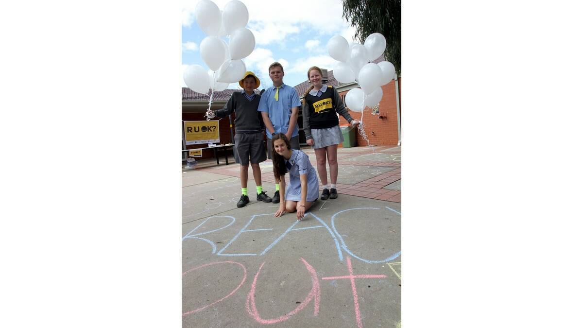 ST FRANCIS College year 9 SRC members Brianna Pilon (front) and Jake Wood (left), with year 10 Reach Out committee members Dave Francis and Kate Charles, spread the messages of White Balloon Day and R U OK? Day.