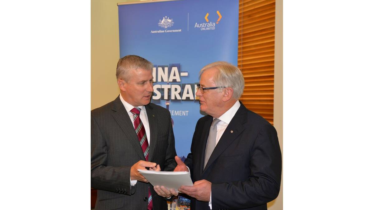 MEMBER for Riverina Michael McCormack (left) discusses the Australia-China Free Trade Agreement with Federal Minister for Trade Andrew Robb.