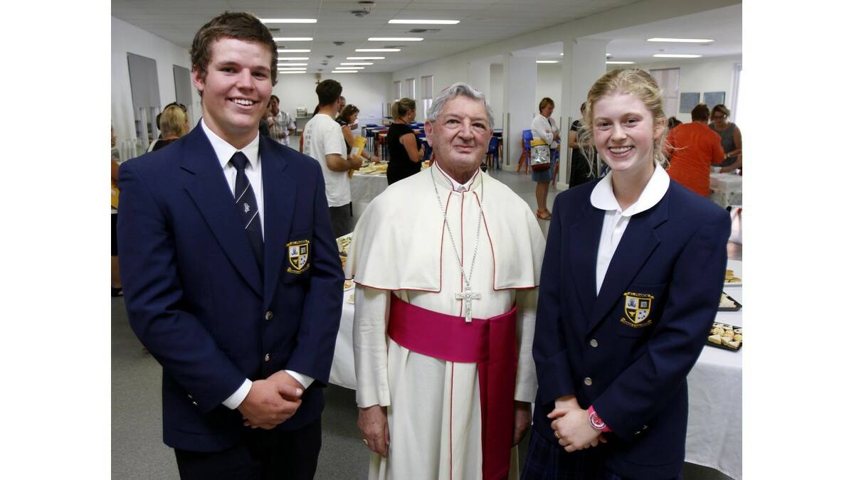 ST FRANCIS College held its presentation day last Friday, with Bishop Gerard Hanna (centre) congratulating year 11 dux Lachlan Lane (left) and academic excellence award-winner Charlotte Lander on their achievements. The pair are also the incoming captains for 2015.