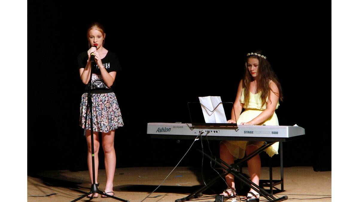 ELISE Holt (left) and Molly Wright perform Stay at Leeton High School's MADD night.