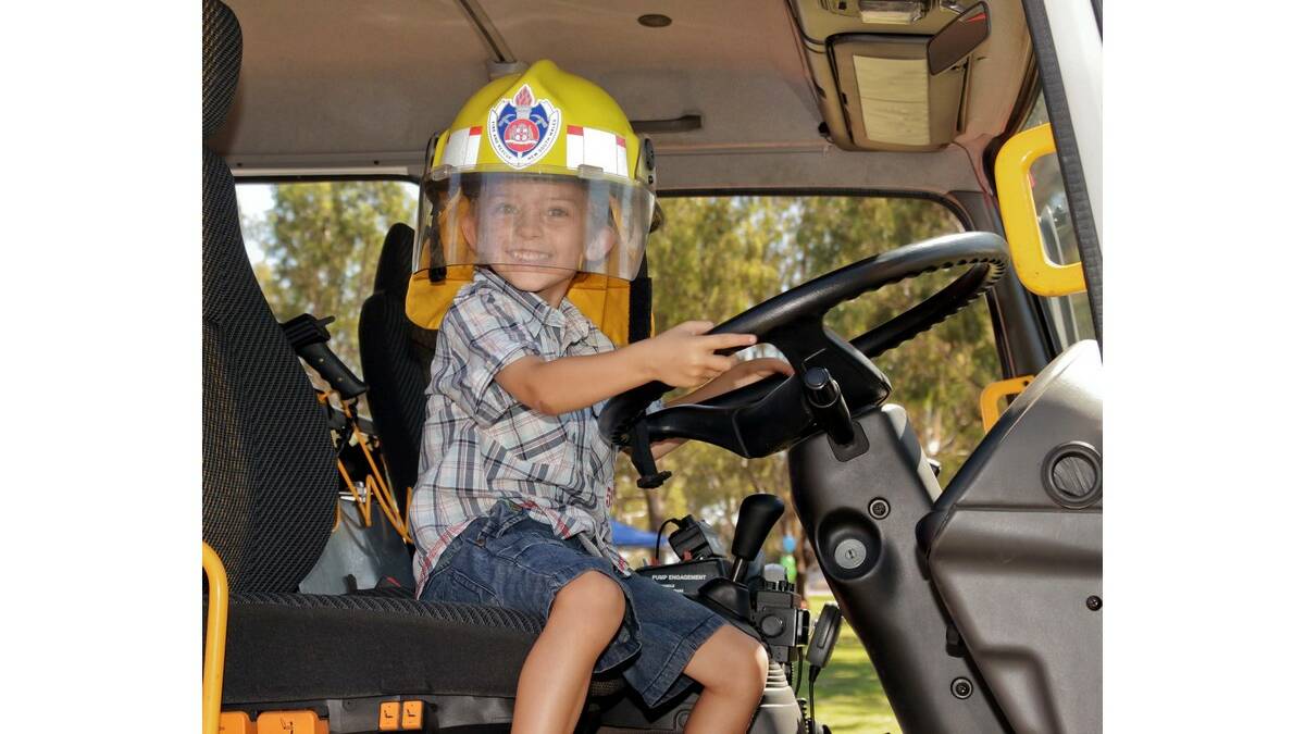 COOPER Carnley, 4, tests out the life of a firefighter at Ambassador Quest entrant Emily Kennedy�s Little Big Day Out event last Saturday.