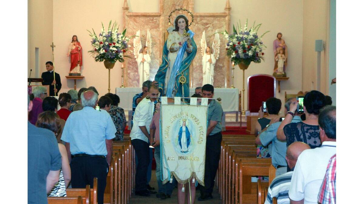 THE Madonna is carried through St Joseph's Catholic Church during Festa Della Madonna on Saturday.