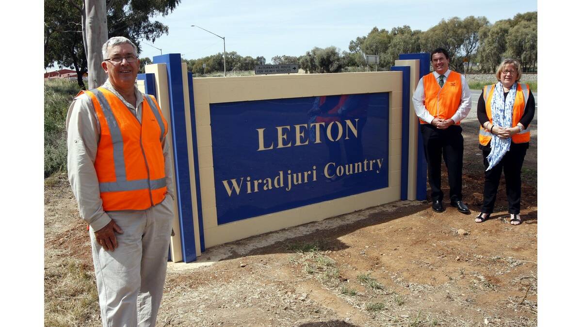 A NEW town sign has been erected on the north-west approach to Leeton, with (from left) councillor Peter Davidson, Leeton Shire Council economic development, tourism and events manager Peter Kennedy and Leeton and District Local Aboriginal Land Council chief executive officer Karen Davy pleased with its look.
