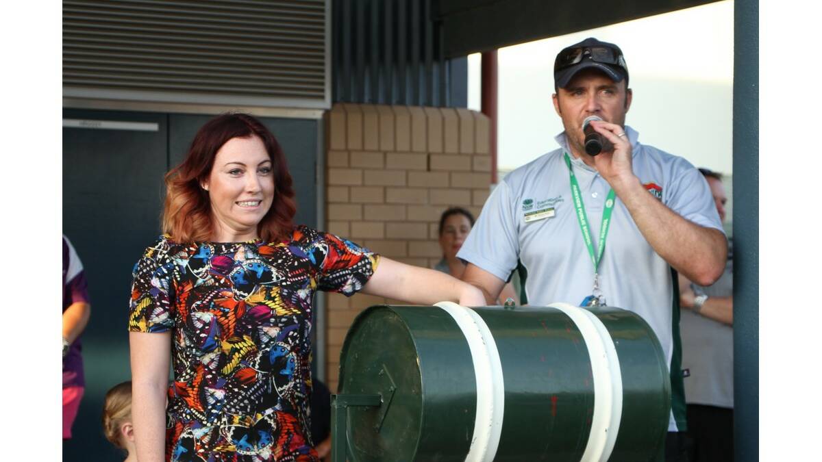 CARLY Portch helps Parkview Public School principal Travis Irvin draw the major prize raffle at the Christmas carnival last week.