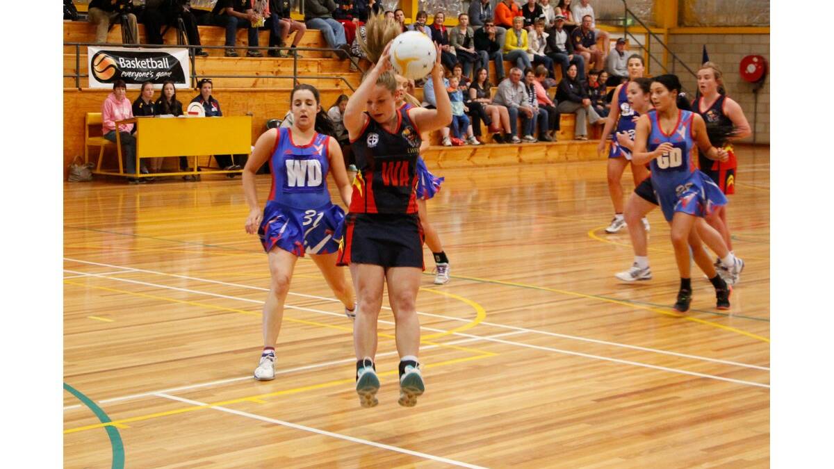 KATE Vallance comes back to earth with the ball in C grade.