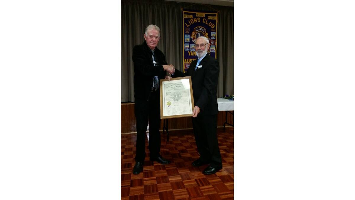 OUTGOING Yanco Lions Club president Buster Ryan (left) welcomes new president Ian Peacock to the role.
