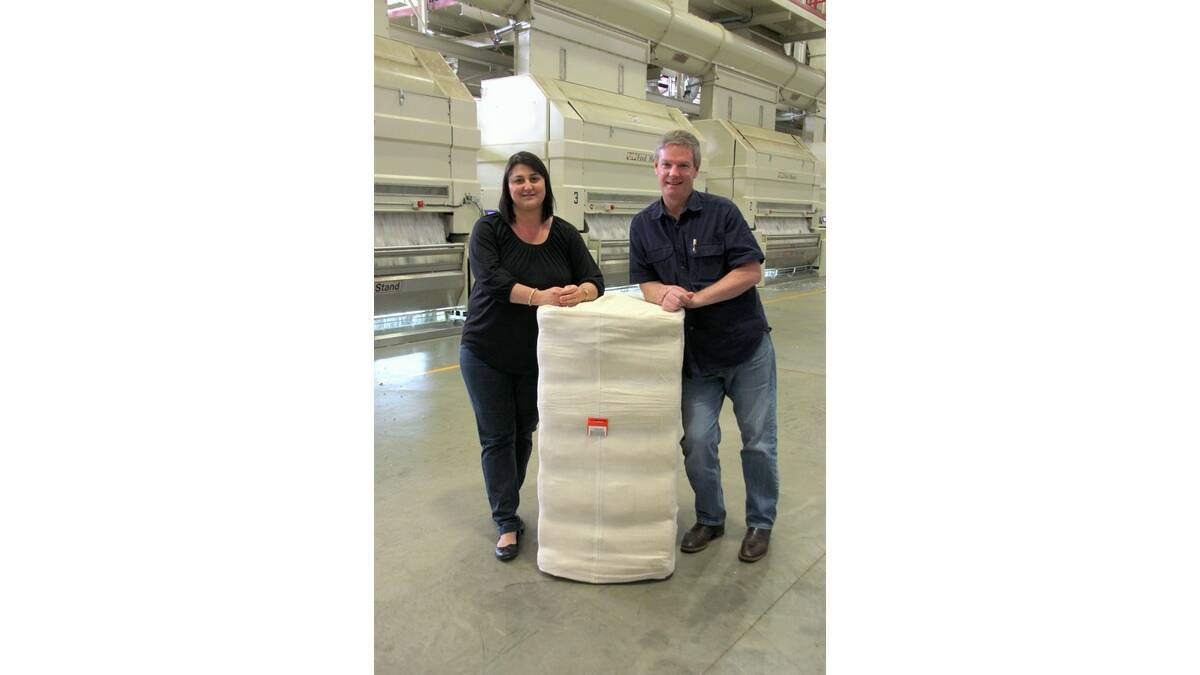 ANITA and Scott Hogan with the 500,000th bale produce at Southern Cotton's Whitton gin.