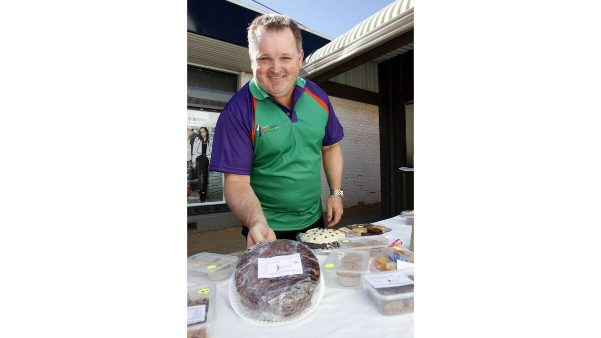 JUMPSTART president Rob Hillier shows off some of the baked goods available at last week's street stall.