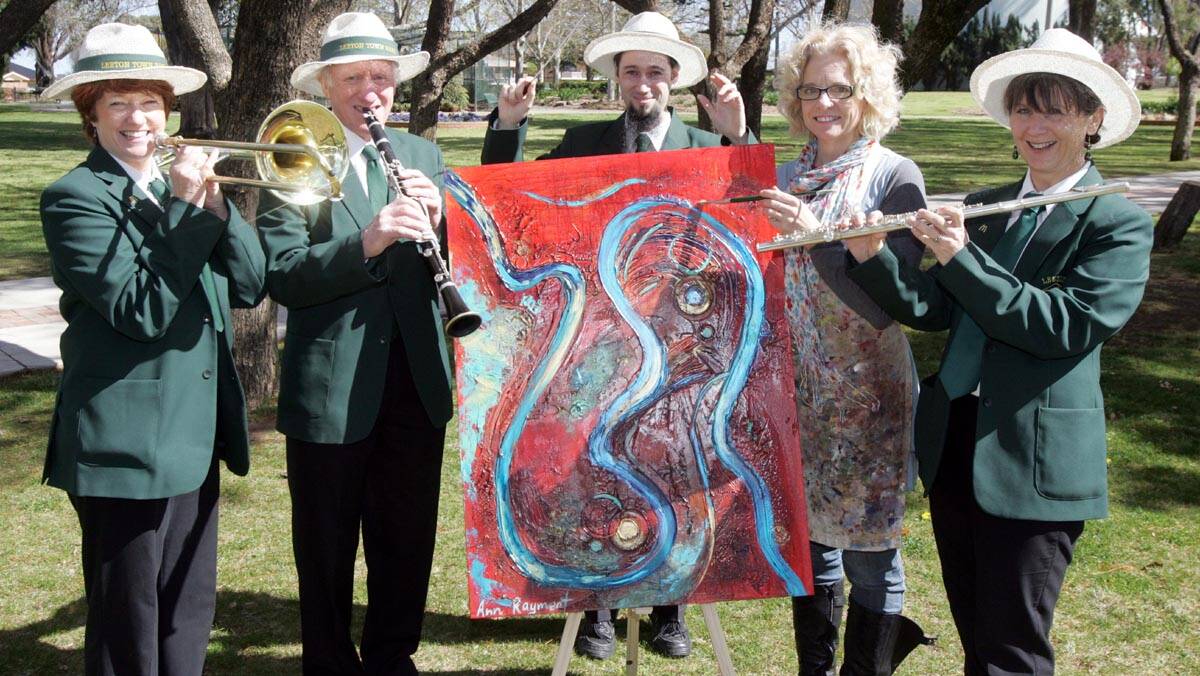 THE Leeton Town Band Outback Spectacular will be held in November, with many events planned, including Brass in the Park that will feature live artwork. Getting ready for the event are (from left) Maree McCrum, Barry Allen, Trevor Peacock, Ann Rayment and Fiona Stevens.