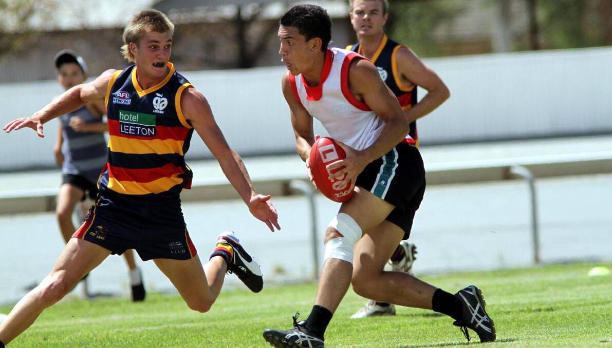 SIALE Howe (right) tries to beat an opponent in the Crows' intra-club game on Sunday.