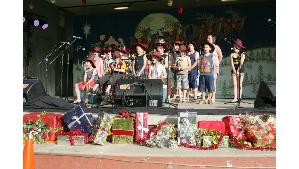 LIGHT Up Leeton kicked off the festive season in style on Sunday, with the big man in red also coming to town in preparation for Christmas. 