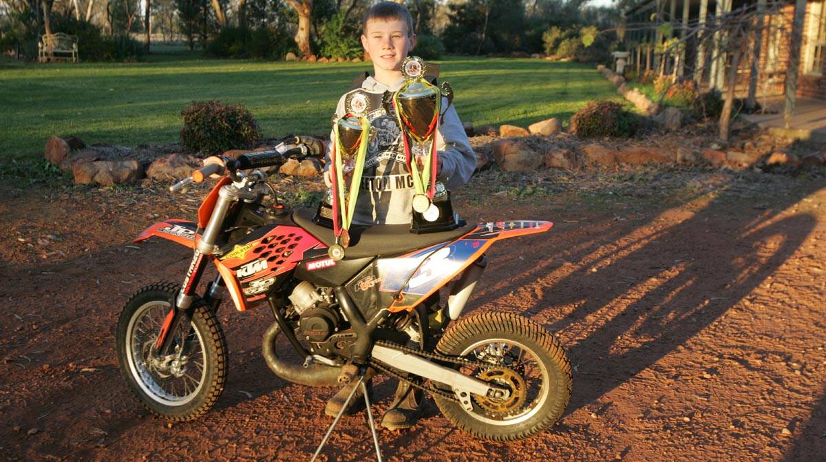 KRUSE Brady shows off the trophies he won at the recent Australian Junior Dirt Track Championships.