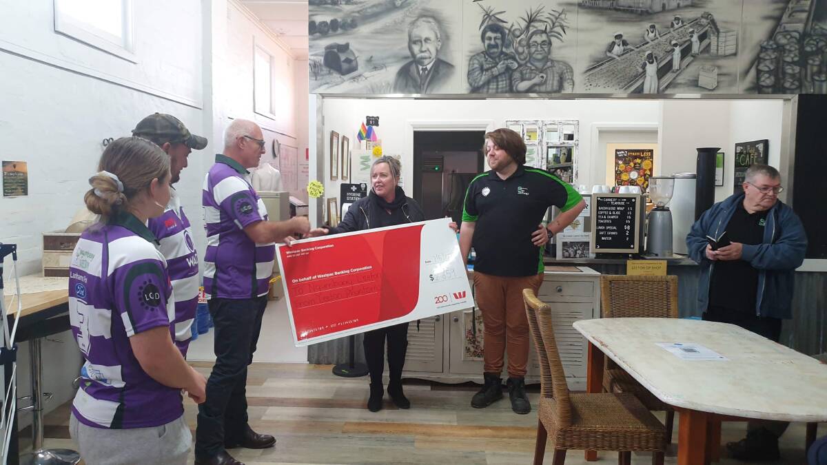 DONATION: The Leeton Phantoms present the Ngumbaay group with the donation. PHOTO: Contributed