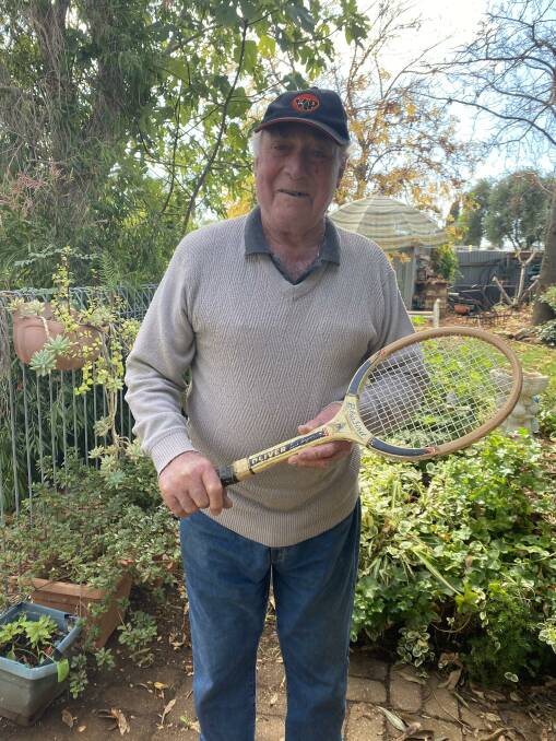 LOVE AT FIRST SIGHT: Cecil Bell poses with his very first tennis racquet, a Blackbird Junior which he found at a garage sale. PHOTO: Elizabeth Gracie
