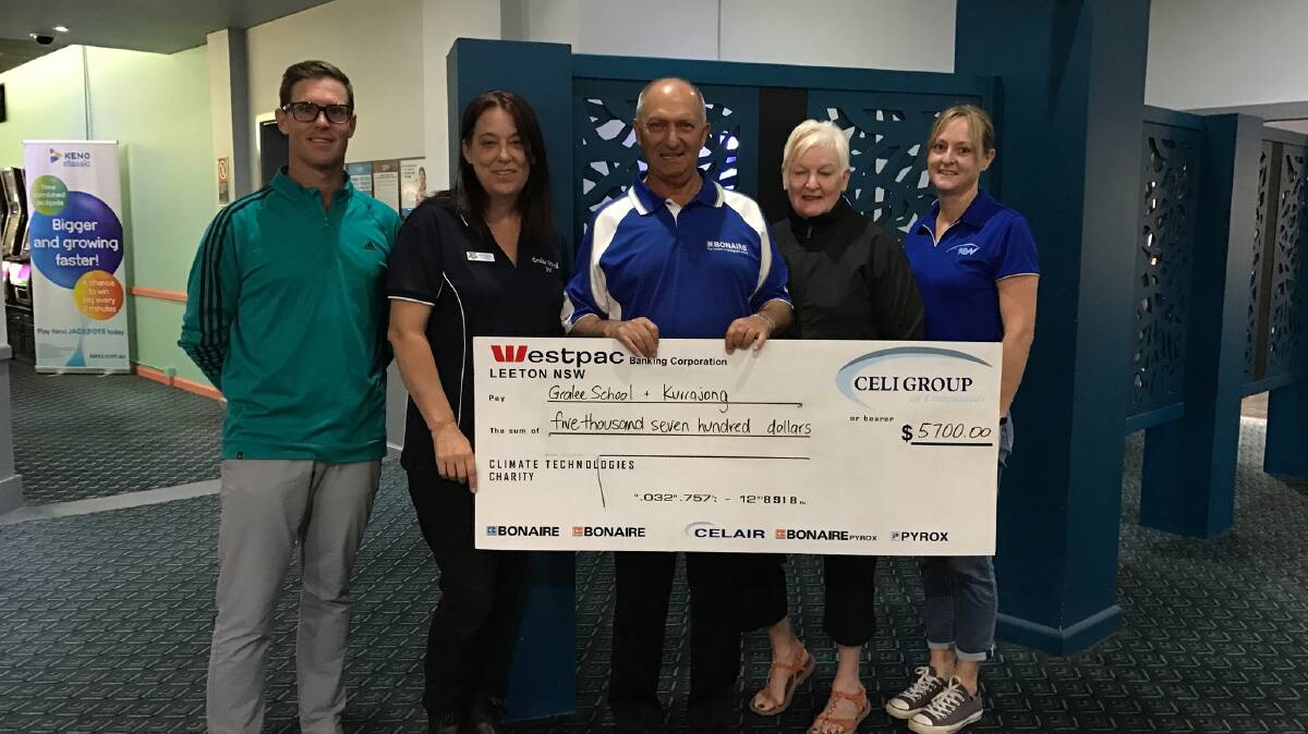 HAPPY RECIPIENTS: Leeton Golf Club present The Gralee School with a cheque following successful 2019 fundraising 'Big Hole' golf day PHOTO: Jason Mimmo