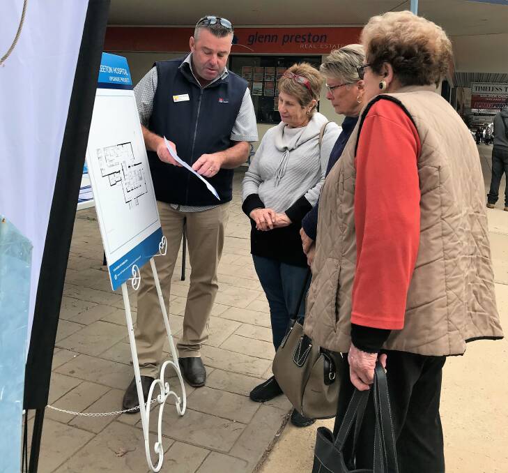 HAVING A LOOK: Leeton residents at a drop in community session held recently with the concept design plans for the Leeton Hospital upgrade. 