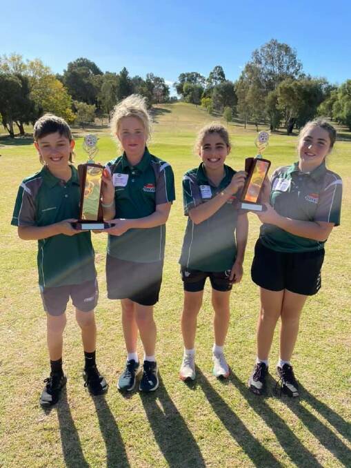 WINNERS ARE GRINNERS: Cruze Dale (left), Gracie Daly, Salvatore Alampi and Imogen Lang with the Overall Pointscore and Handicap Trophies from the LNPSSA Cross Country Carnival.
