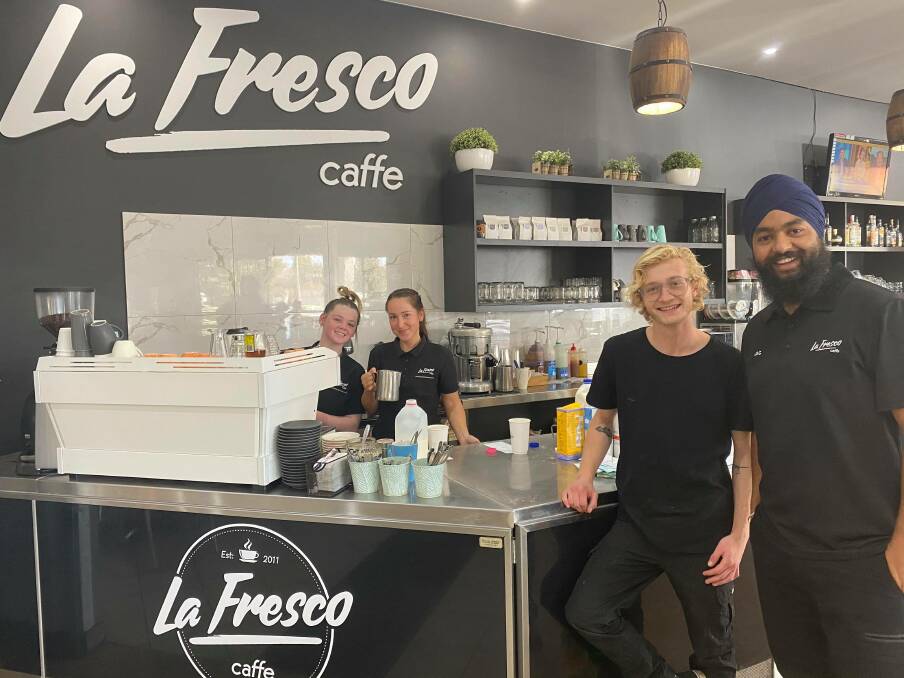 SERVICE WITH A SMILE: Jagmohan Singh and workers at the cafe PHOTO: Elizabeth Gracie