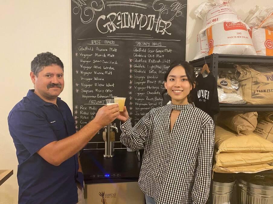 BOTTOMS UP: Megan Tai and Adam Gaffey have put their blood, sweat and tears into bringing together Griffiths very first craft beer festival. PHOTO: Lizzie Gracie