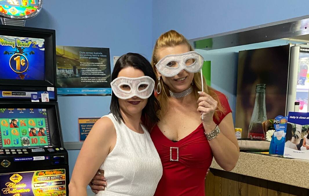 FUNDRAISING: Shannon Morris and Katrina Skene get their Venice ball-goer on to help raise funds for the Whitton Bowling and Recreational Club. PHOTO: Contributed