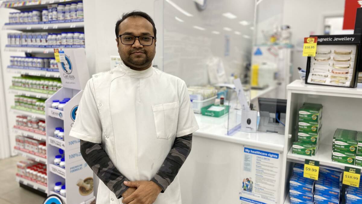 ROLL 'EM UP: Leeton pharmacist Tejaskumar 'TJ' Patel said everyone should give themselves greater protection against the flu. Photo: Vincent Dwyer