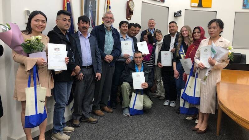 WELCOME: Leeton Multicultural Support Group president Paul Maytom with some of Australia's newest citizens. PHOTO: Contributed