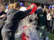COOL OFF: Over 100 buckets of icy water were tipped on Leeton High School teachers on Tuesday in a fundraising effort to help fight MND. PHOTO: Vincent Dwyer