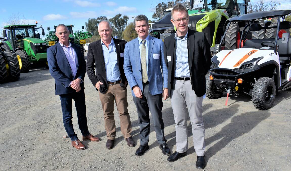 ALL ABOUT WATER: Hilton Taylor, Michael Murray, Steve Whan, and Phillip Glyde talk water policy at the Cotton Australia collective in Griffith. PHOTO: Kenji Sato