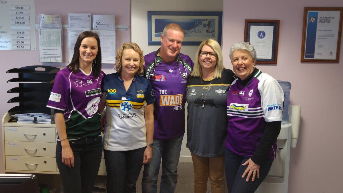 JERSEY DAY: Wearing their team colours are Carrie Walker, Christine Wallace, Simon Wallace, Donna Hillier and Sharyn Mulloy for Jersey Day.
