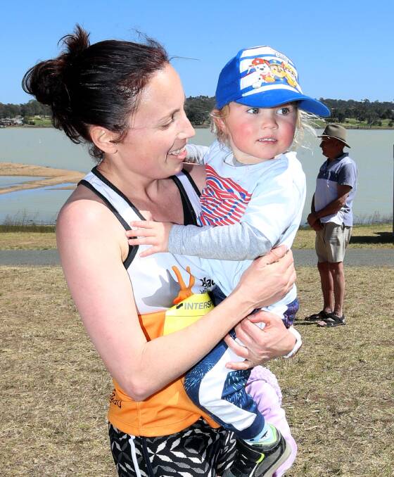 WOMEN'S CHAMPION: Women's 10km winner Sally Cassilles of Leeton with son Theo. Picture: Les Smith