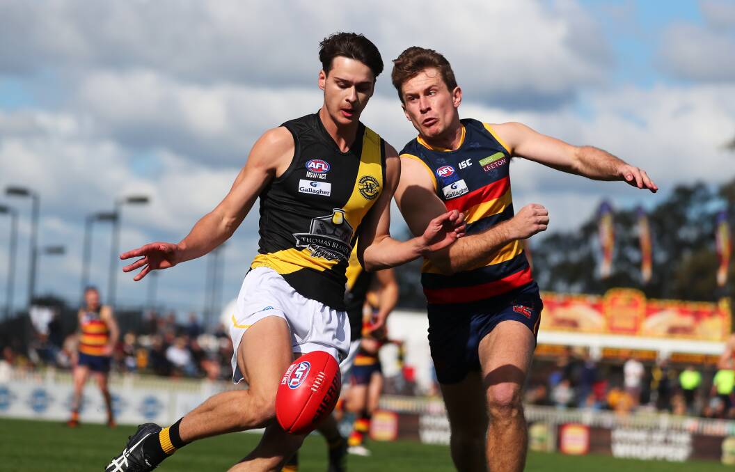 THRILLER: Wagga Tigers' Hamish Gilmore and Leeton-Whitton's Mitchell Hardie go toe-to-toe in Saturday's second semi final. Picture: Emma Hillier